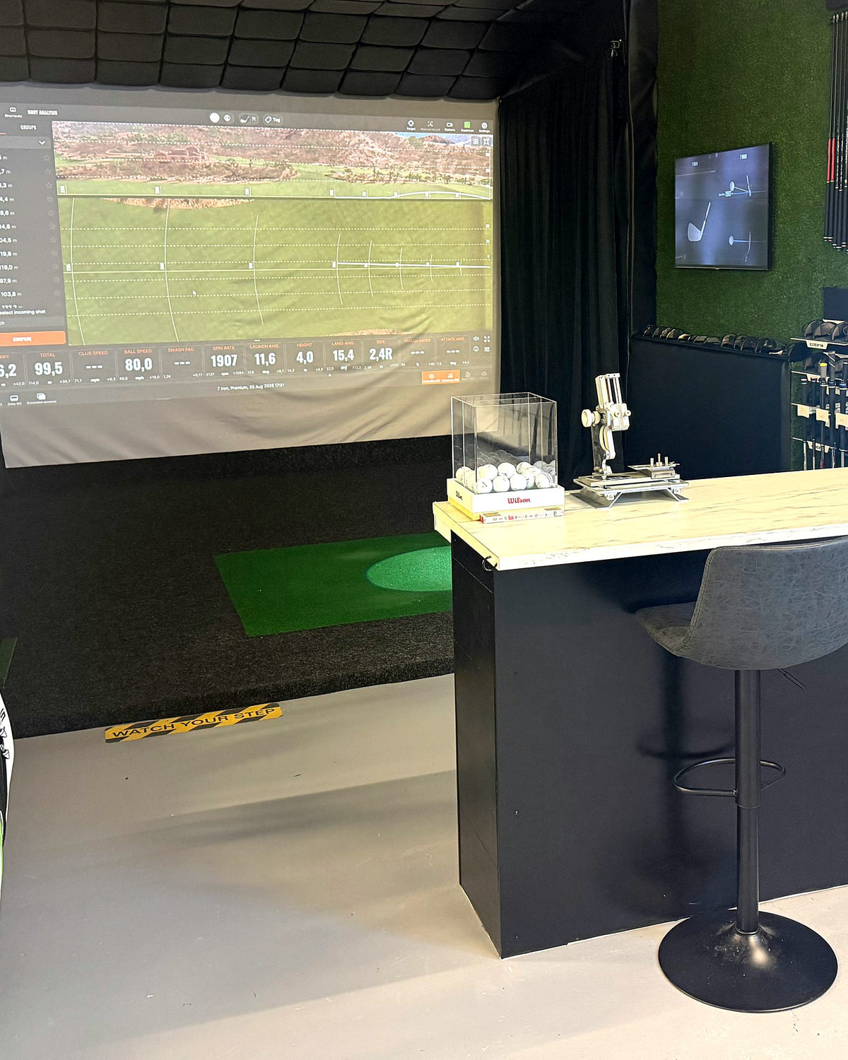 Fitting studio with simulator screen and counter