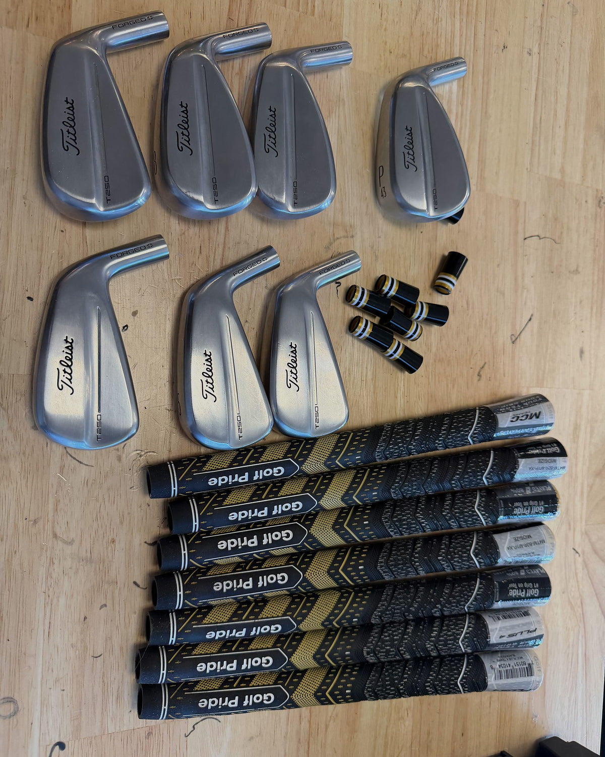 Iron heads, ferrules and Golf Pride grips ready to build