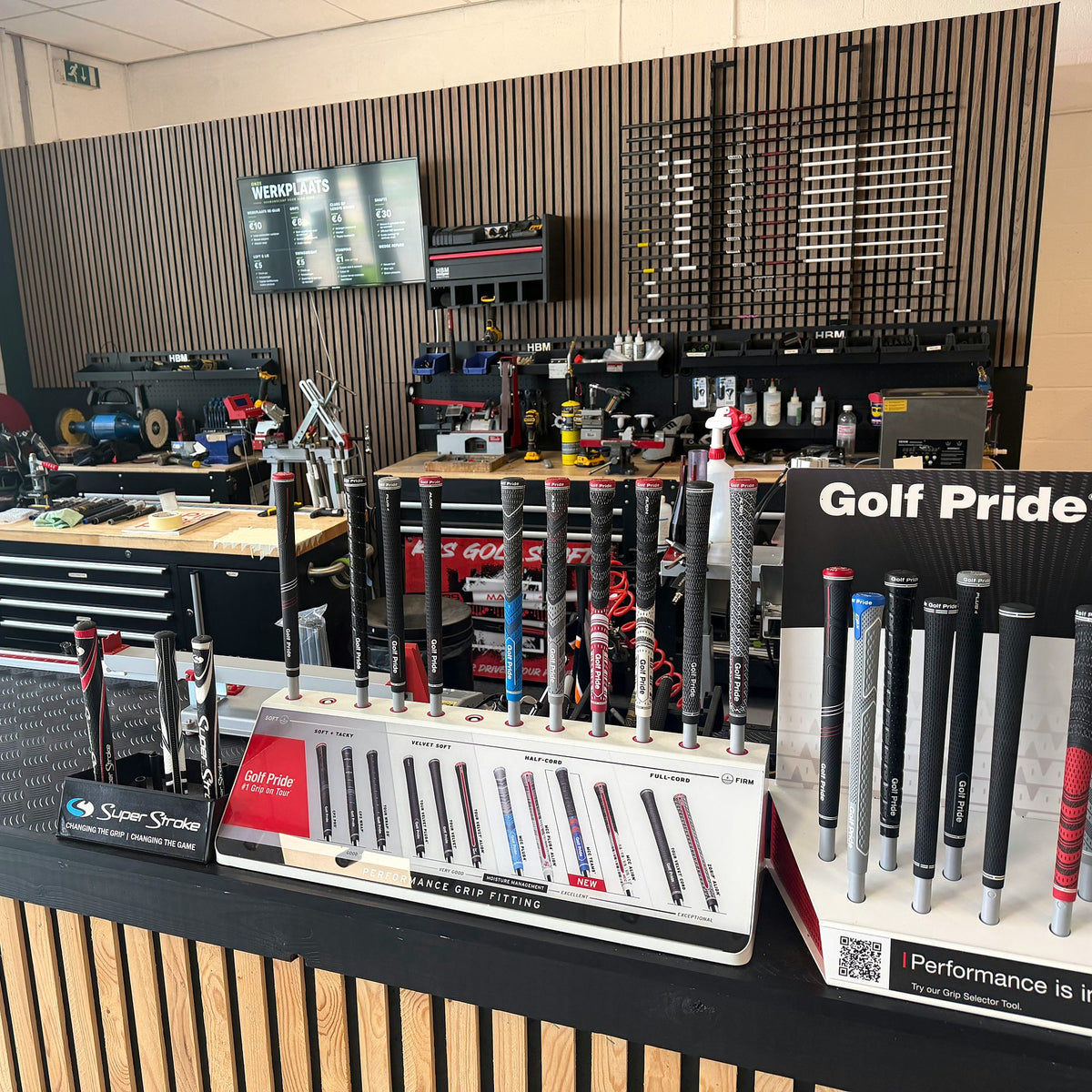 The Shaftlab workshop with workbenches and the grip wall